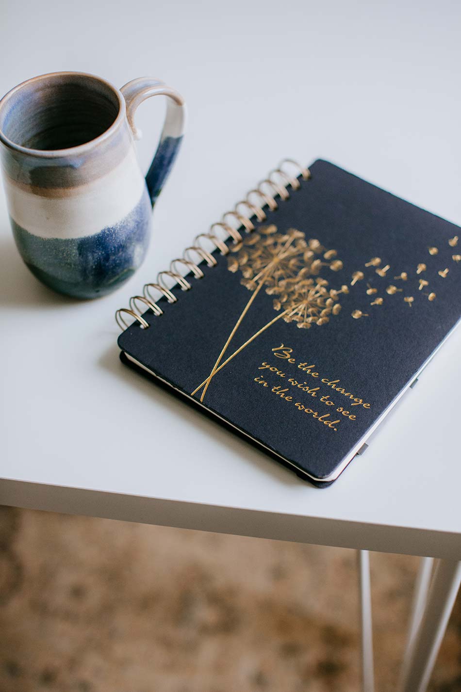 Notebook and coffee mug