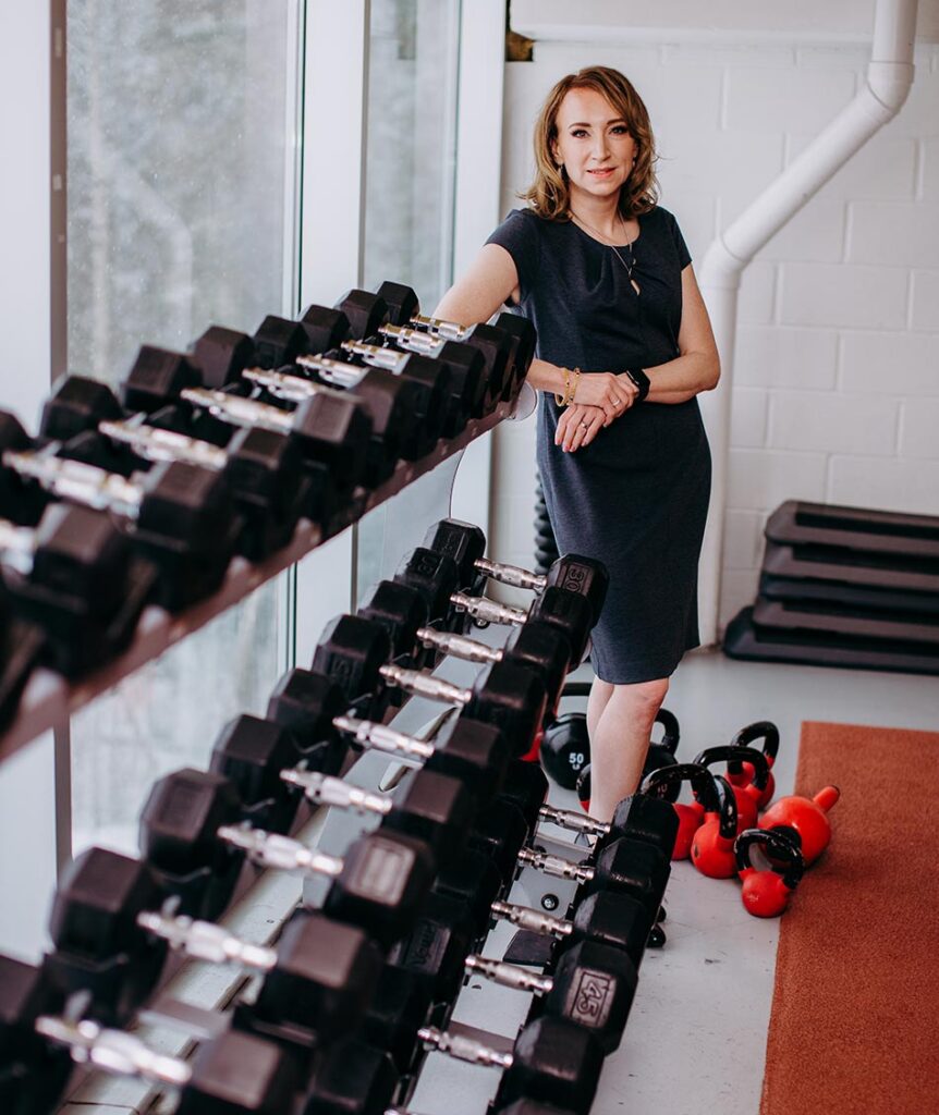 Catherine in the gym with weights